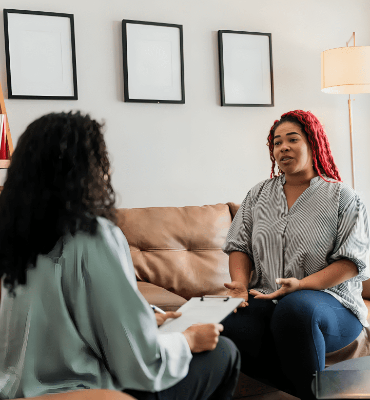 Woman talking to therapist on couch