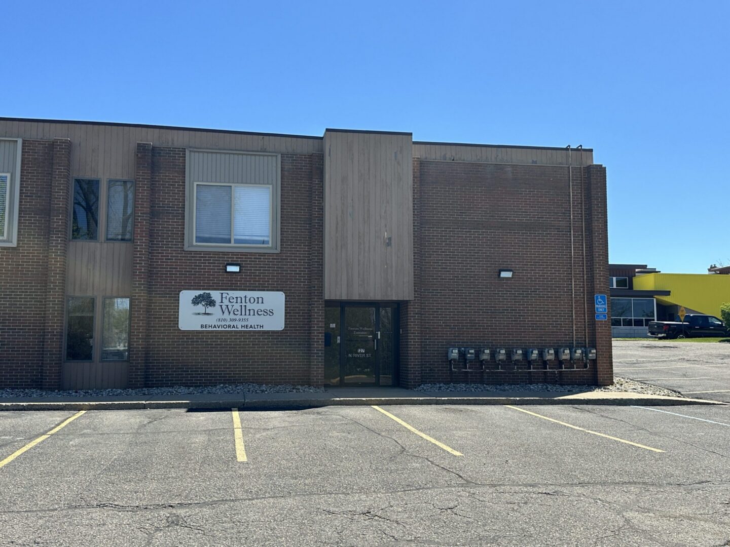 Two-story building under clear blue sky