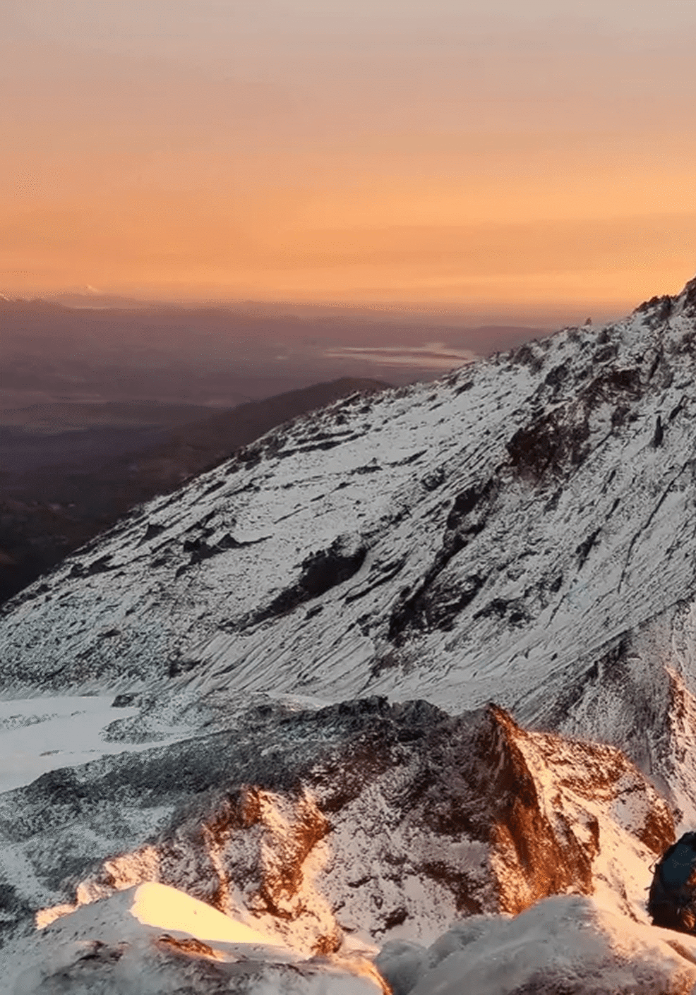 Snowy mountain peak at sunrise